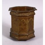 A 19TH CENTURY ISLAMIC SPANISH BRONZE OCTAGONAL MORTAR, with engraved motif, 10cm x 8.5 wide.