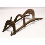 A LARGE WOOD & METAL POSSIBLY EGYPTIAN CAMEL SADDLE / SEAT, the timbers enclosed and decorated