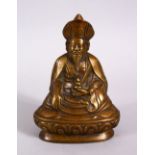 A CHINESE BRONZE FIGURE OF BUDDHA,L in a seated position holding an implement, 13cm.