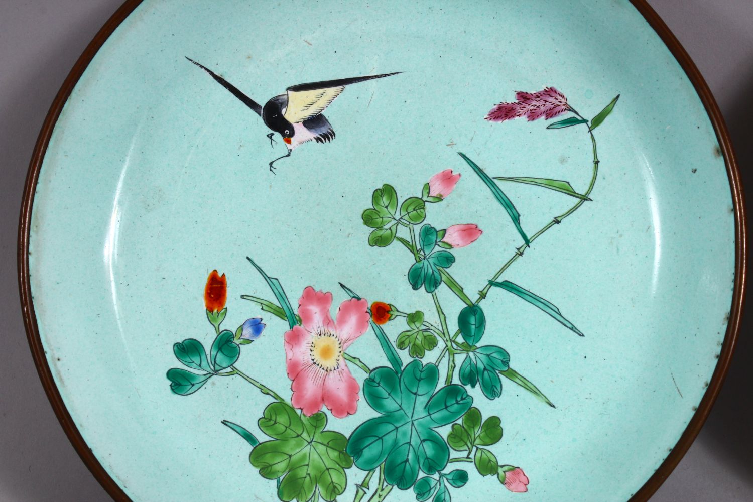 A PAIR OF 19TH / 20TH CENTURY CHINESE ENAMEL SAUCER DISHES, each decorated witih scenes of a bird in - Image 2 of 4