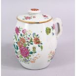 AN 18TH CENTURY CHINESE FAMILLE ROSE PORCELAIN TANKARD & COVER, decorated with native floral