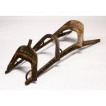 A LARGE WOOD & METAL POSSIBLY EGYPTIAN CAMEL SADDLE / SEAT, the timbers enclosed and decorated