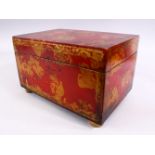 A PERSIAN RED & GOLD LACQUER DECORATED LIDDED BOX - With floral motif decoration upon four bun feet,
