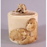 A JAPANESE MEIJI PERIOD CARVED IVORY LIDDED TUSK POT- carved with elephants and monkeys to the side,