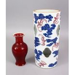 A CHINESE UNDERGLAZE BLUE & IRON RED PORCELAIN HAT STAND, decorated with bats in iron red and