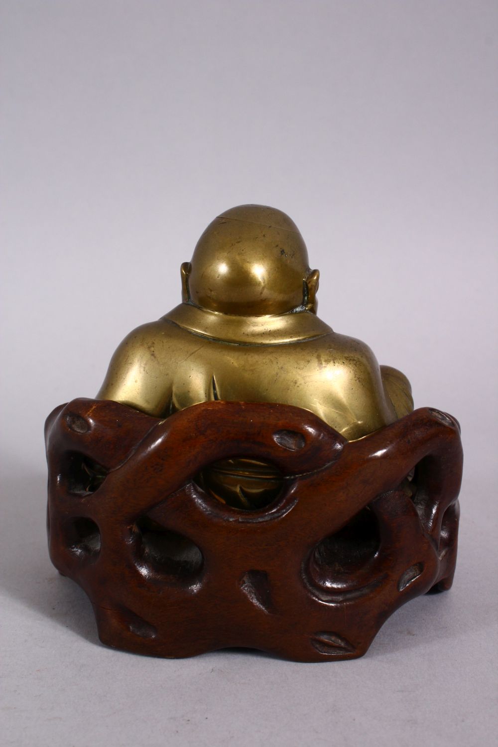 A 19TH CENTURY CHINESE BRONZE FIGURE OF BUDDHA & STAND, seated with his hand upon his knee, in a - Image 3 of 6