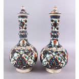 A LARGE PAIR OF 19TH CENTURY OTTOMAN TURKISH KUTAHIYA LIDDED PORCELAIN BOTTLE VASES,each with floral