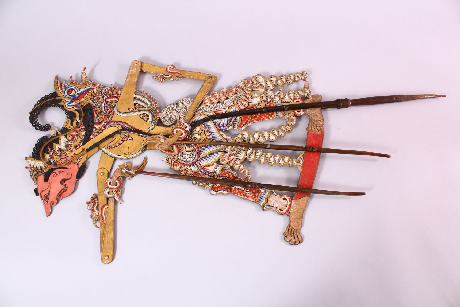 A LARGE 19TH CENTURY INDONESIAN SHADOW PUPPET WITH RHINO HORN STICKS, 73cm. - Image 5 of 7