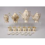 A LARGE SILVER PERSIAN TEA SET WITH KUWAITI EMBLEM, comprising six small cups, 6.5cm, tea pot, 22cm,