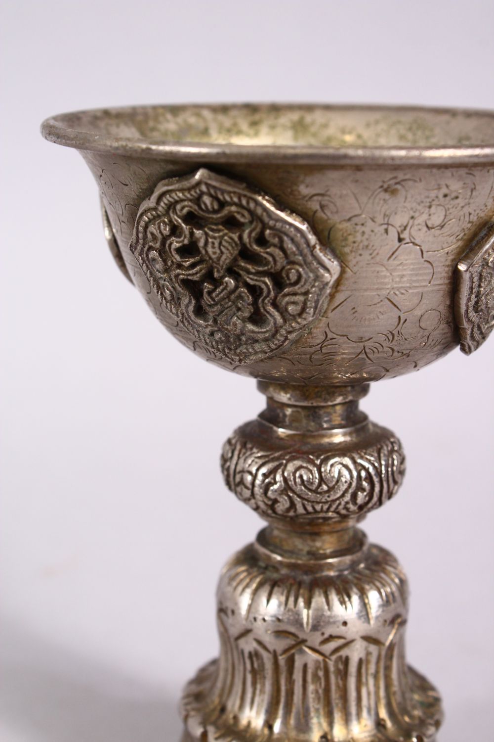 A GOOD 19TH CENTURY SINO TIBETAN WHITE METAL STEM CUP, with buddhistic object decoration, 11.5cm - Image 3 of 4