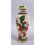A 19TH CENTURY CHINESE CRACKLE GLAZED FAMILLE VERTE PORCELAIN WARRIOR VASE & COVER, decorated with
