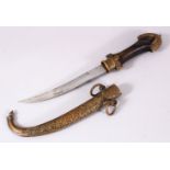 A GOOD ISLAMIC MOROCCAN DAGGER, with a carved brass sheath, and carved wood handle, 41cm