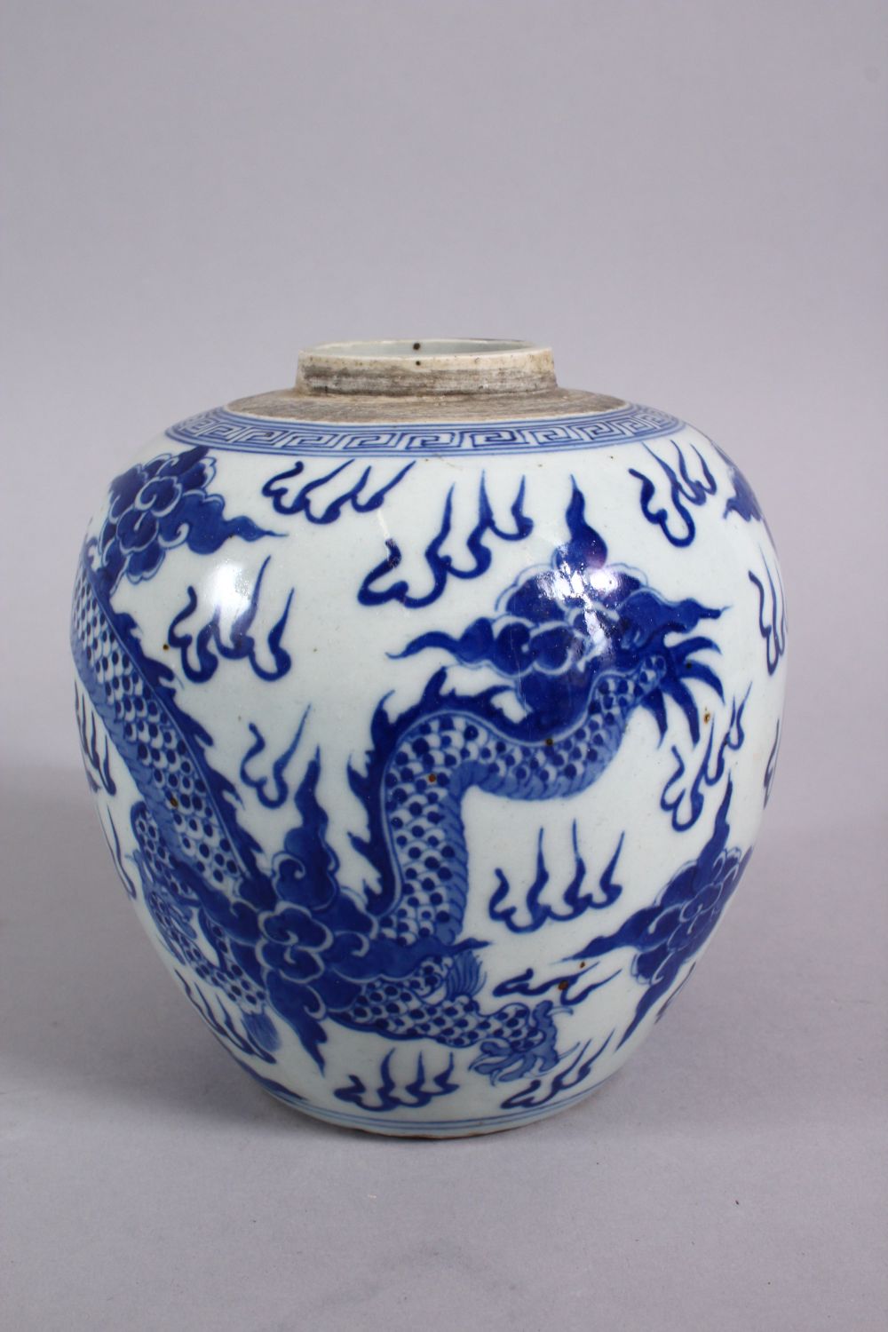 A CHINESE BLUE & WHITE PORCELAIN DRAGON GINGER JAR, decorated with a dragon amongst clouds 14cm - Image 3 of 5