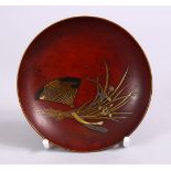 A JAPANESE MEIJI PERIOD GOLD & RED LACQUER DISH, decorated with scenes of a fan and lotus, base