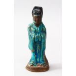 A GOOD EARLY CHINESE MING FIGURE OF A GENERAL, the figure glazed with turquoise, 14cm high,