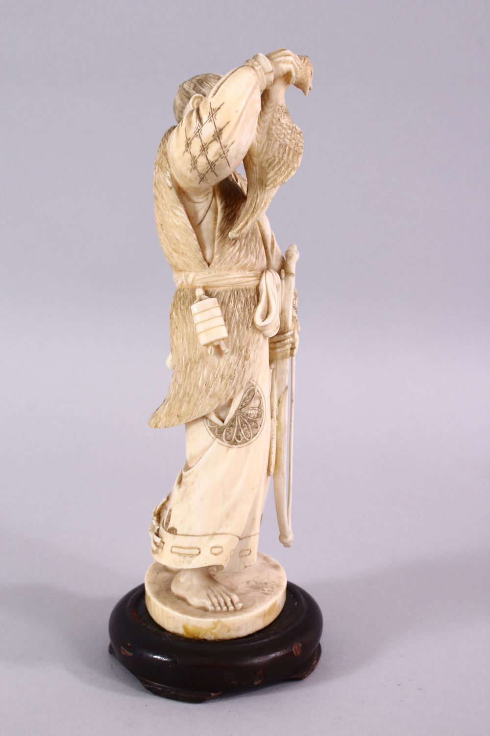 A FINE JAPANESE MEIJI PERIOD CARVED IVORY OKIMONO OF A HUNTSMAN, stood holding his catch with his - Image 2 of 6