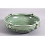 A CHINESE SONG STYLE CELADON MOULDED CHILONG BOWL, with moulded chilong to the rim, boss to the