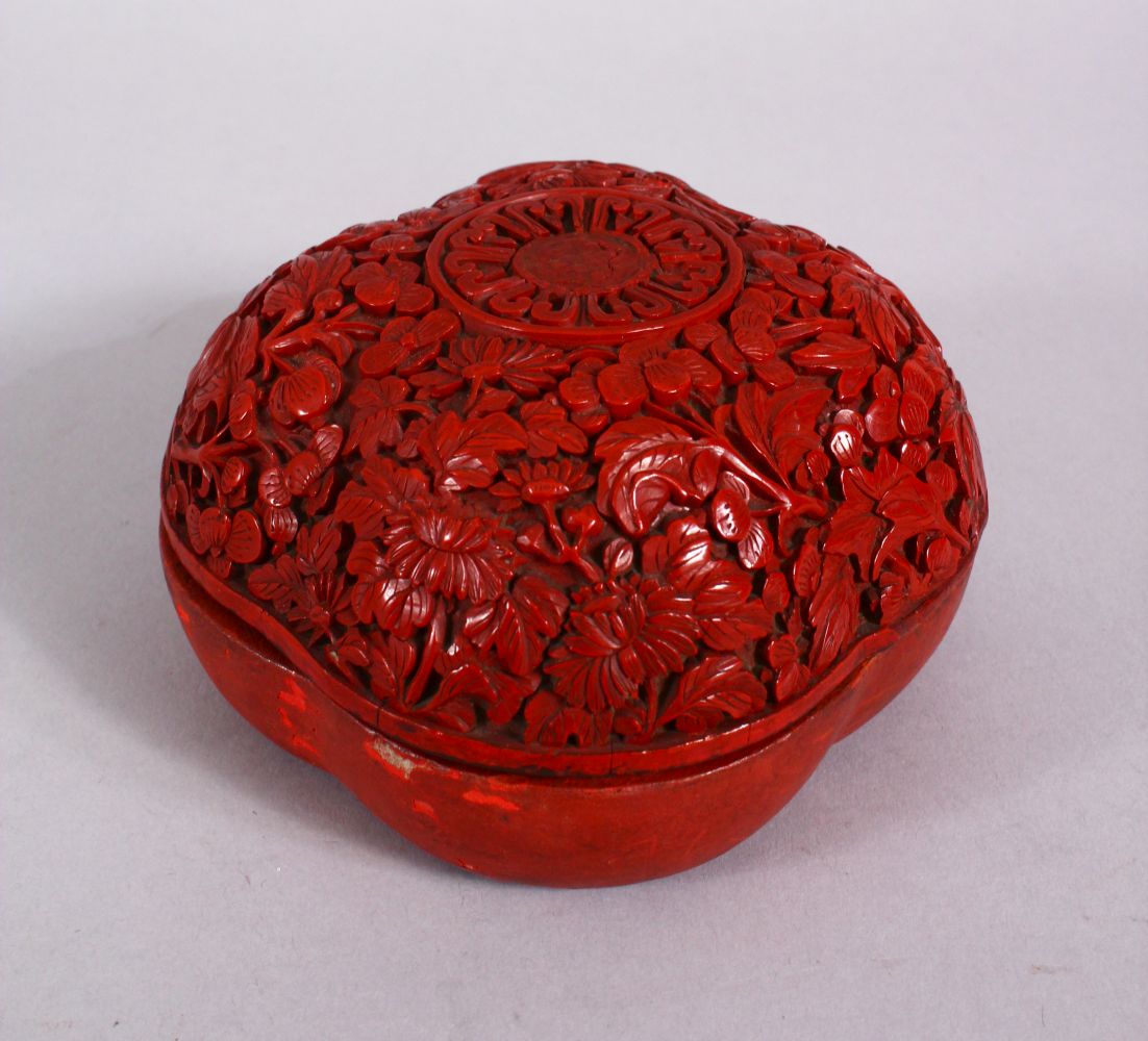 A 19TH / 20TH CENTURY CHINESE CINNABAR LACQUER BOX & COVER, the cover carved with floral decoration,