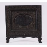 AN ISLAMIC INDIAN CEYLONESE CARVED EBONY PHOTO FRAME, carved with floral scroll, 24cm x 25.5