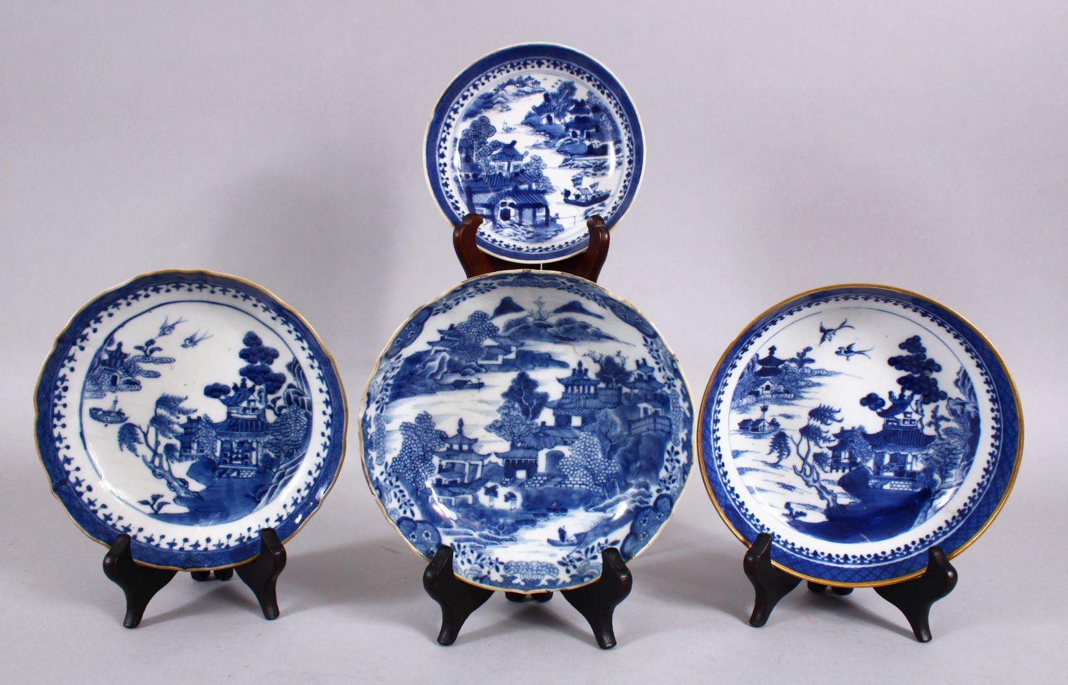 A LOT OF 4 CHINESE 18TH / 19TH CENTURY QIANLONG STYLE BLUE & WHITE PORCELAIN PLATES, each