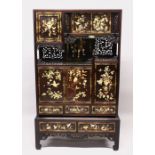 A JAPANESE MEIJI PERIOD SIGNED SHIBAYAMA INLAID CABINET ON STAND, the panels carved inlaid with