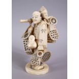 A JAPANESE MEIJI PERIOD CARVED IVORY FIGURE OF A BASKET SELLER, the man stood holding his baskets