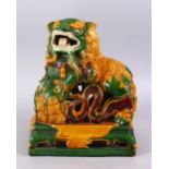 A GOOD CHINESE SANCAI GLAZED POTTERY FIGURE OF LION DOGS, the larger dog with its paws upon a pup,