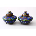 A PAIR OF 19TH / 20TH CENTURY CHINESE CLOISONNE LIDDED KORO, the body of the koro's decorated with a