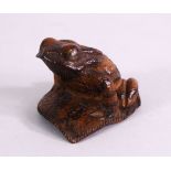 A JAPANESE 19TH / 20TH CENTURY CARVED WOOD SEATED FROG UPON LEAF - the frog in a seated position