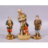 THREE JAPANESE SATSUMA CERAMIC FIGURES, depicting a man and boy with catch, underside signed, 18cm