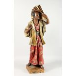 A LARGE ORIENTAL POTTERY STANDING FIGURE OF A MAN holding a large fan. 40ins high.