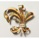 A YELLOW GOLD AND DIAMOND SET SPRAY BROOCH.