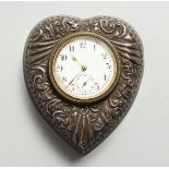 A VICTORIAN SILVER HEART SHAPED WATCH CASE, decorated with scrolls. 3.5ins x 3ins. Birmingham