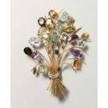 A VERY SUBSTANTIAL YELLOW GOLD BROOCH set with precious stones.