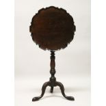 A GEORGE III DESIGN MAHOGANY TILT TOP TRIPOD TABLE, with piecrust circular top, turned column