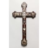 A CHINESE ROSEWOOD CRUCIFIX, with mother-of-pearl inlaid floral decoration. 18.25ins x 10.25ins.