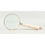 A MAGNIFYING GLASS WITH MOTHER-OF-PEARL HANDLE.