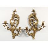 A PAIR OF BRONZE WALL SCONCES.