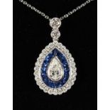 A SUPERB 18CT WHITE GOLD, SAPPHIRE AND DIAMOND PENDANT on a chain.