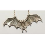 A HEAVY SILVER BAT DESIGNER NECKLACE.