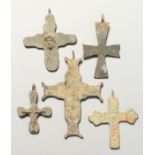 FIVE ROMAN METAL CROSSES. 7cms - 9cms.