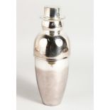 A SILVER PLATED SNOWMAN COCKTAIL SHAKER. 10ins high.