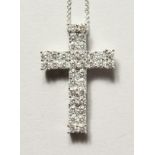 A SUPERB 18CT WHITE GOLD DIAMOND CRUCIFIX, 1.30ct on a chain.