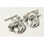 A PAIR OF SILVER HORSES HEAD CUFFLINKS.