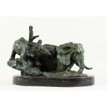 A GOOD BRONZE GROUP of a bull elephant and calf, in a naturalistic setting, on a marble base.