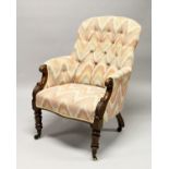 A 19TH CENTURY MAHOGANY FRAMED BUTTON UPHOLSTERED ARMCHAIR, with carved "C Scroll" arm caps,