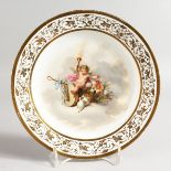 AN ENGLISH DECORATED PARIS PORCELAIN PLATE painted with a winged child in a cloud, seated on a