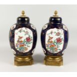 A SUPER LARGE PAIR OF SAMSON OF PARIS FAMILLE ROSE VASES AND COVERS, rich blue ground with famille