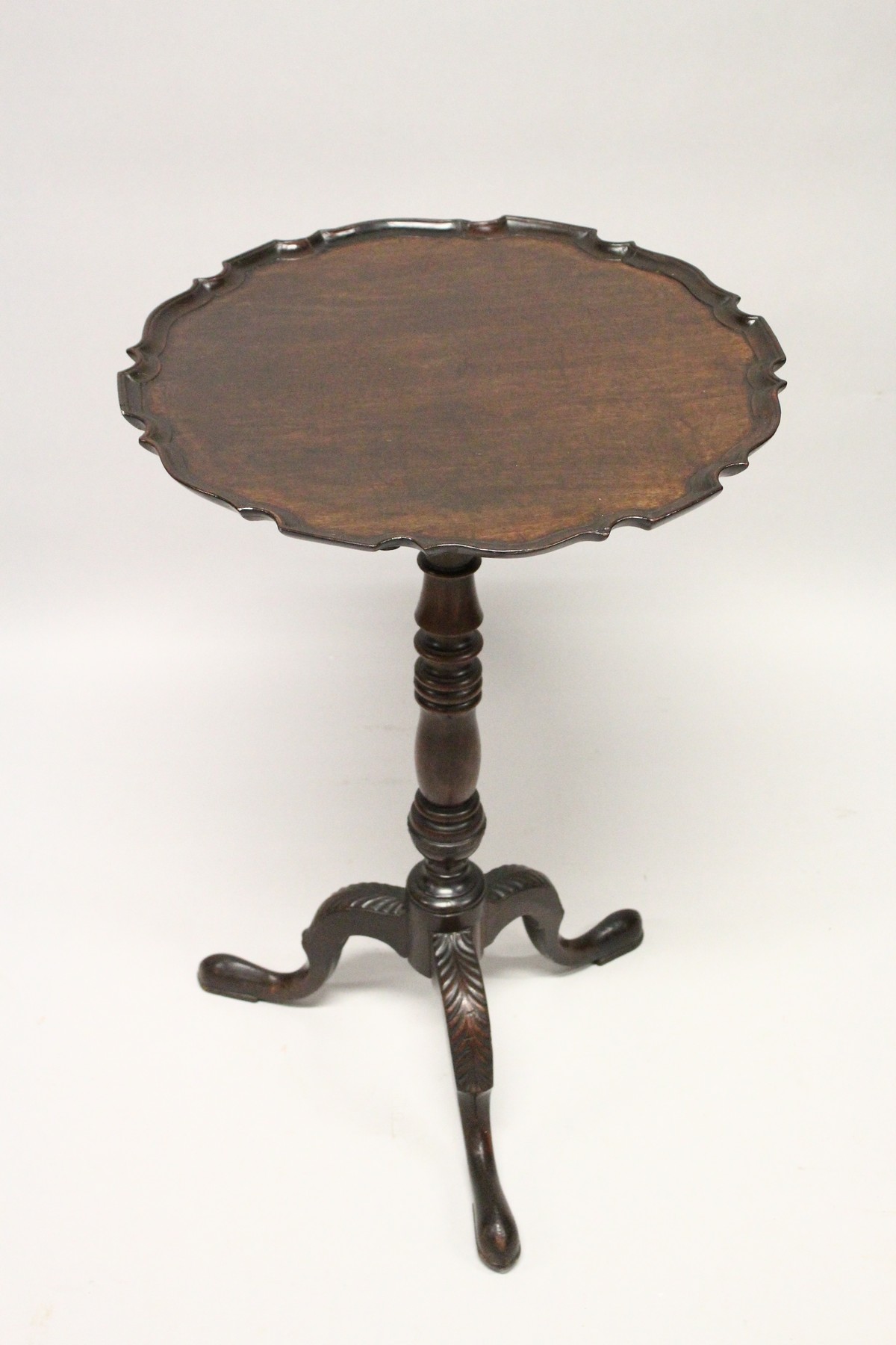 A GEORGE III DESIGN MAHOGANY TILT TOP TRIPOD TABLE, with piecrust circular top, turned column - Image 4 of 4