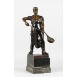 A 1940-1950 BRONZE STEEL WORKER, on a square base and marble plinth. 18ins high.